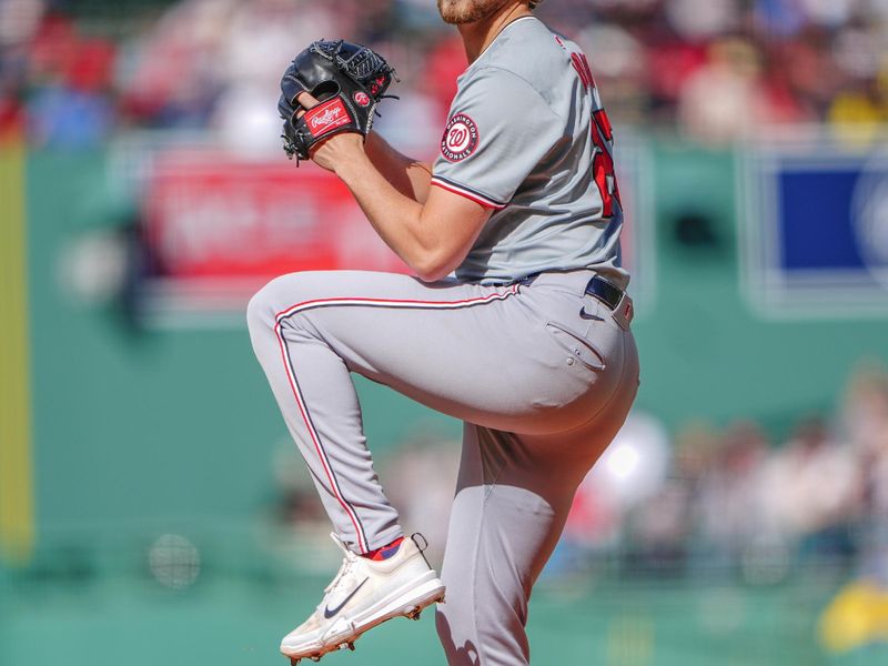 May 11, 2024; Boston, Massachusetts, USA;  Washington Nationals pitcher Jake Irvin (27) delivers a pitch against the Boston Red Sox during the first inning at Fenway Park. Mandatory Credit: Gregory Fisher-USA TODAY Sports
