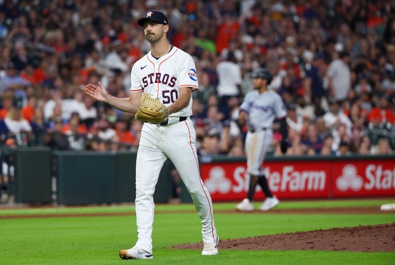 Jul 11, 2024; Houston, Texas, USA; Houston Astros relief pitcher Tayler Scott (50) reacts as Miami Marlins catcher Nick Fortes (4) (not pictured) runs down the first base line before being thrown out with men in scoring position to end the top of the sixth inning at Minute Maid Park. Mandatory Credit: Thomas Shea-USA TODAY Sports