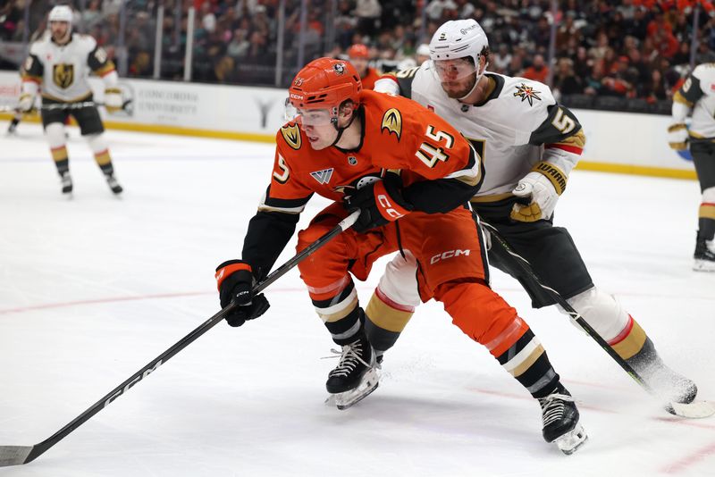 Feb 1, 2026; Anaheim, California, USA;  Anaheim Ducks right wing Beckett Sennecke (45) and Vegas Golden Knights defenseman Jeremy Lauzon (5) chase the puck during the second period at Honda Center. Mandatory Credit: Kiyoshi Mio-Imagn Images