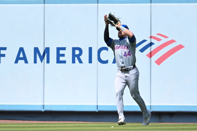 Apr 20, 2024; Los Angeles, California, USA; New York Mets outfielder Harrison Bader (44) makes a catch against the Los Angeles Dodgers during the fourth inning at Dodger Stadium. Mandatory Credit: Jonathan Hui-USA TODAY Sports