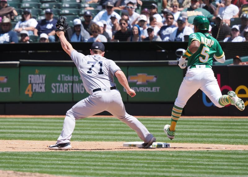 Jun 29, 2023; Oakland, California, USA; New York Yankees relief pitcher Ian Hamilton (71) makes a play against Oakland Athletics third baseman Jace Peterson (6) during the sixth inning at Oakland-Alameda County Coliseum. Mandatory Credit: Kelley L Cox-USA TODAY Sports