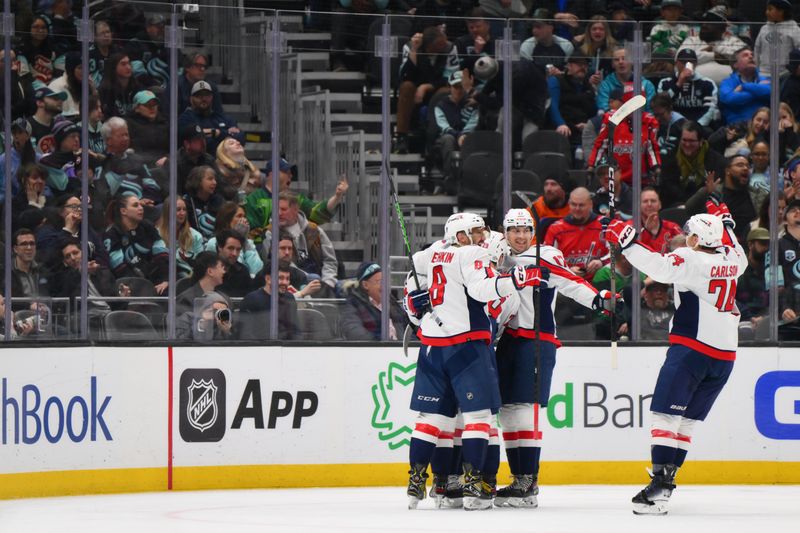 Mar 14, 2024; Seattle, Washington, USA; The Washington Capitals celebrate after a goal scored by right wing T.J. Oshie (77) against the Seattle Kraken during the second period at Climate Pledge Arena. Mandatory Credit: Steven Bisig-USA TODAY Sports