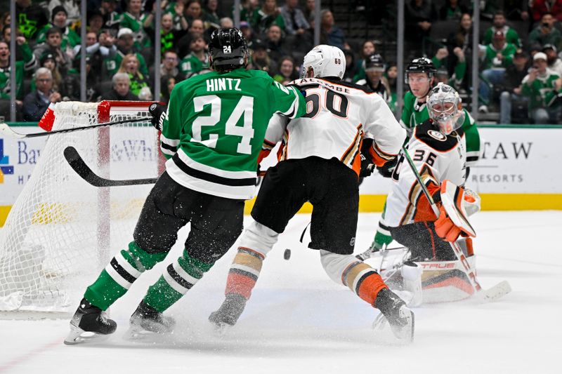 Jan 25, 2024; Dallas, Texas, USA; Dallas Stars defenseman Thomas Harley (55) scores the game winning goal past Anaheim Ducks goaltender John Gibson (36) as Ducks defenseman Jackson LaCombe (60) and Stars center Roope Hintz (24) look on during the overtime period at the American Airlines Center. Mandatory Credit: Jerome Miron-USA TODAY Sports