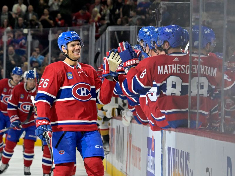 Nov 16, 2023; Montreal, Quebec, CAN; Montreal Canadiens defenseman Johnathan Kovacevic (26) celebrates with teammates after scoring a goal against the Vegas Golden Knights during the first period at the Bell Centre. Mandatory Credit: Eric Bolte-USA TODAY Sports