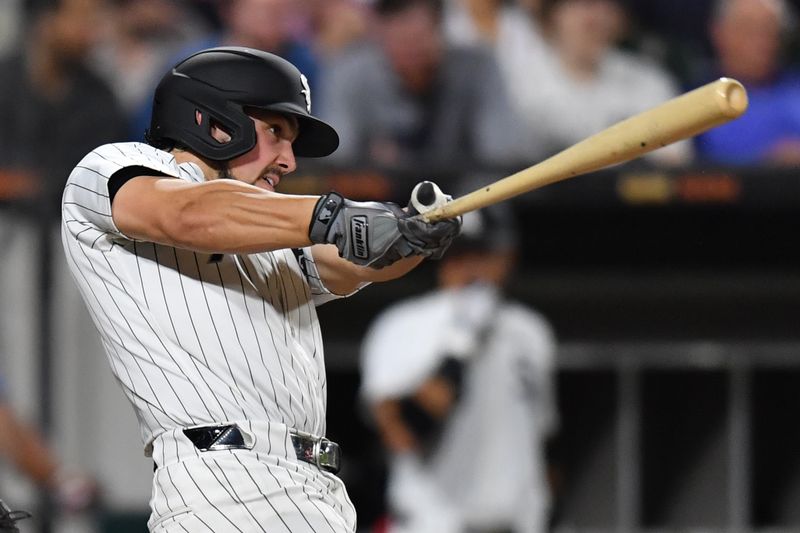 Jul 30, 2024; Chicago, Illinois, USA; Chicago White Sox left fielder Dominic Fletcher (7) singles during the seventh inning against the Kansas City Royals at Guaranteed Rate Field. Mandatory Credit: Patrick Gorski-USA TODAY Sports