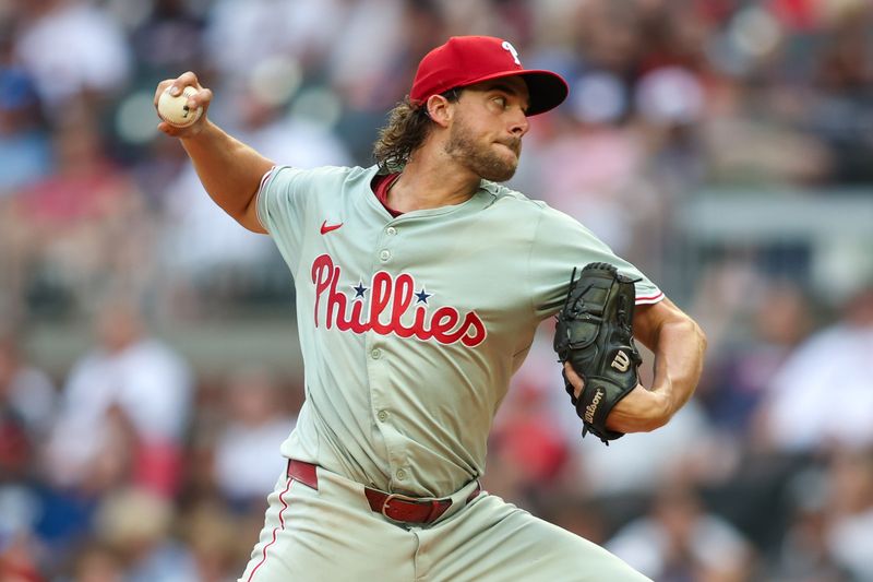 Jul 5, 2024; Atlanta, Georgia, USA; Philadelphia Phillies starting pitcher Aaron Nola (27) throws against the Atlanta Braves in the second inning at Truist Park. Mandatory Credit: Brett Davis-USA TODAY Sports