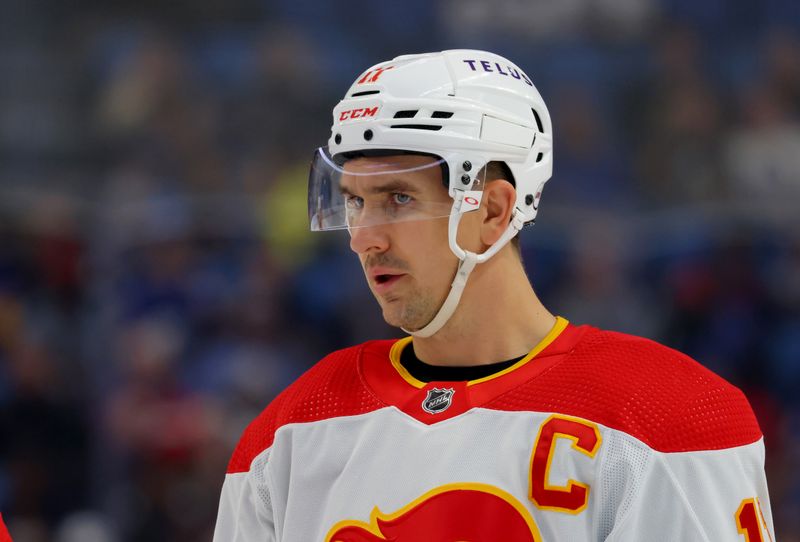 Oct 19, 2023; Buffalo, New York, USA;  Calgary Flames center Mikael Backlund (11) during the first period against the Buffalo Sabres at KeyBank Center. Mandatory Credit: Timothy T. Ludwig-USA TODAY Sports