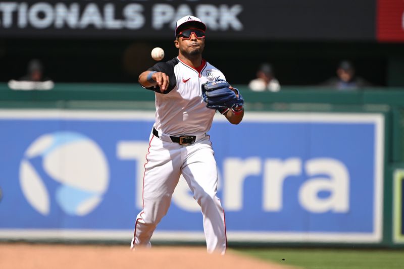 Sep 15, 2024; Washington, District of Columbia, USA; Washington Nationals shortstop Nasim Nunez (26) attempts a throw to first base against the Miami Marlins during the third inning at Nationals Park. Mandatory Credit: Rafael Suanes-Imagn Images