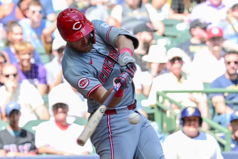 Aug 11, 2024; Milwaukee, Wisconsin, USA; Cincinnati Reds catcher Tyler Stephenson (37) hits a solo home run in the fifth inning against the Milwaukee Brewers at American Family Field. Mandatory Credit: Benny Sieu-USA TODAY Sports