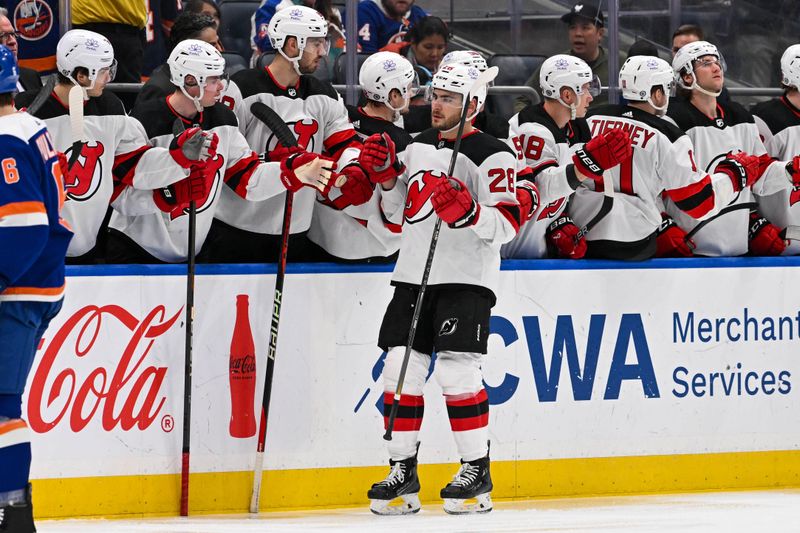 Mar 24, 2024; Elmont, New York, USA;  New Jersey Devils right wing Timo Meier (28) celebrates his goal against the New York Islanders during the second period at UBS Arena. Mandatory Credit: Dennis Schneidler-USA TODAY Sports