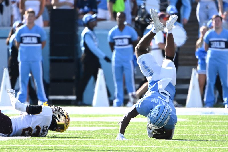 Sep 16, 2023; Chapel Hill, North Carolina, USA;  North Carolina Tar Heels wide receiver J.J. Jones (5) is tackled by Minnesota Golden Gophers defensive back Tre'Von Jones (2) in the second quarter at Kenan Memorial Stadium. Mandatory Credit: Bob Donnan-USA TODAY Sports