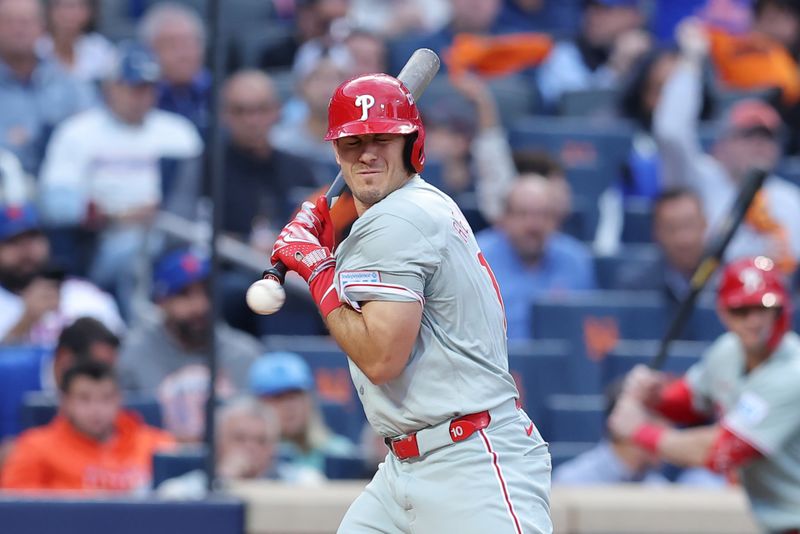 Oct 8, 2024; New York City, New York, USA; Philadelphia Phillies catcher J.T. Realmuto (10) is hit by a pitch in the second inning against the New York Mets during game three of the NLDS for the 2024 MLB Playoffs at Citi Field. Mandatory Credit: Brad Penner-Imagn Images