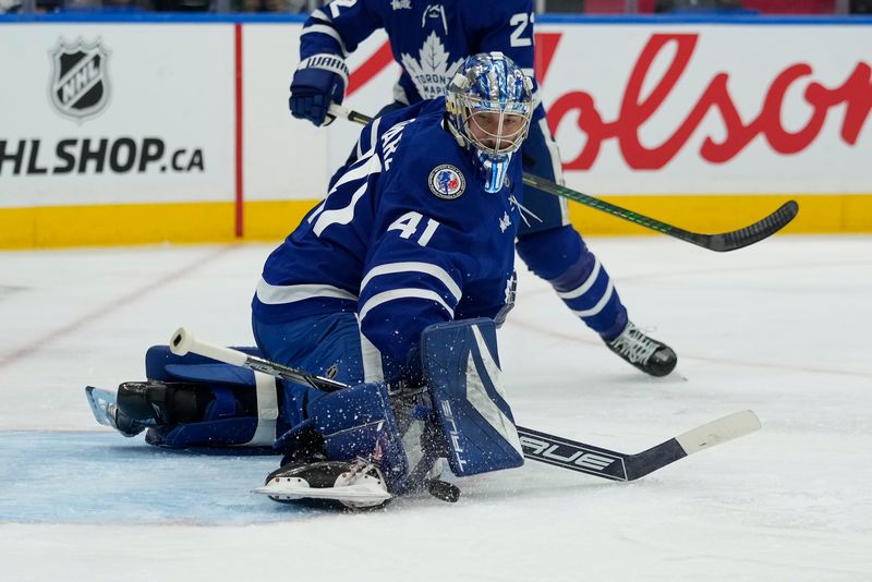 Nov 8, 2024; Toronto, Ontario, CAN; Toronto Maple Leafs goaltender Anthony Stolarz (41) makes a save against the Detroit Red Wings during the second period at Scotiabank Arena. Mandatory Credit: John E. Sokolowski-Imagn Images