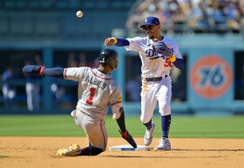 Sep 3, 2023; Los Angeles, California, USA;  Atlanta Braves second baseman Ozzie Albies (1) is out at first as Los Angeles Dodgers right fielder Mookie Betts (50) throws to first for a double play in the ninth inning at Dodger Stadium. Mandatory Credit: Jayne Kamin-Oncea-USA TODAY Sports