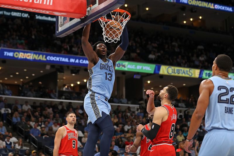 MEMPHIS, TENNESSEE - OCTOBER 28: Jaren Jackson Jr. #13 of the Memphis Grizzlies dunks against Zach LaVine #8 of the Chicago Bulls during the first half at FedExForum on October 28, 2024 in Memphis, Tennessee. NOTE TO USER: User expressly acknowledges and agrees that, by downloading and or using this photograph, User is consenting to the terms and conditions of the Getty Images License Agreement. (Photo by Justin Ford/Getty Images)