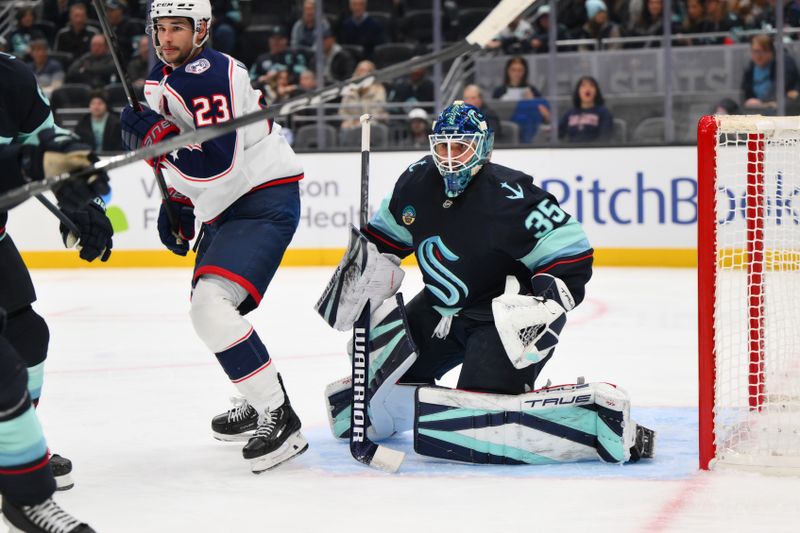 Nov 12, 2024; Seattle, Washington, USA; Seattle Kraken goaltender Joey Daccord (35) defends the goal during the second period against the Columbus Blue Jackets at Climate Pledge Arena. Mandatory Credit: Steven Bisig-Imagn Images