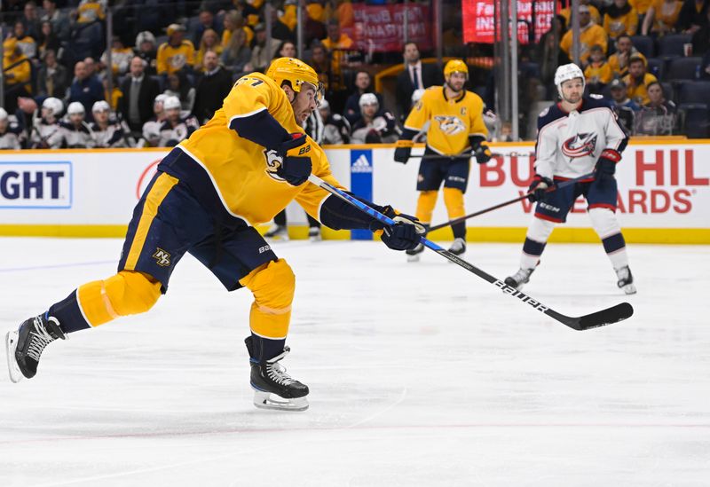 Jan 17, 2023; Nashville, Tennessee, USA;  Nashville Predators defenseman Ryan McDonagh (27) takes a shot on goal against the Columbus Blue Jackets during the third period at Bridgestone Arena. Mandatory Credit: Steve Roberts-USA TODAY Sports