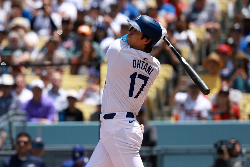 May 5, 2024; Los Angeles, California, USA;  Los Angeles Dodgers designated hitter Shohei Ohtani (17) hits a home run during the first inning against the Atlanta Braves at Dodger Stadium. Mandatory Credit: Kiyoshi Mio-USA TODAY Sports