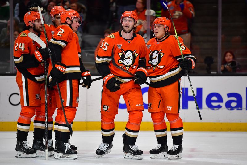 Jan 13, 2026; Anaheim, California, USA; Anaheim Ducks celebrate the empty net goal against the Dallas Stars during the third period at Honda Center. Mandatory Credit: Gary A. Vasquez-Imagn Images