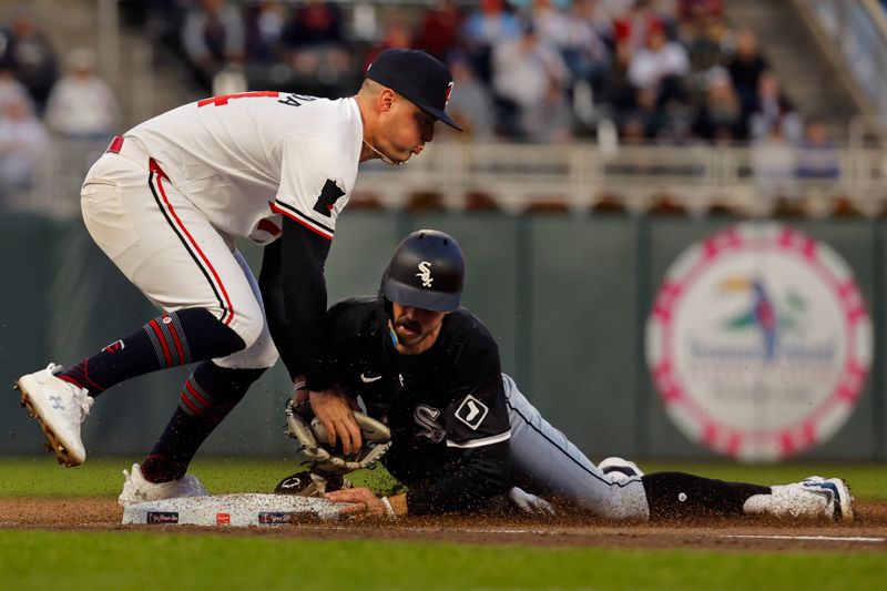 Apr 24, 2024; Minneapolis, Minnesota, USA; Chicago White Sox second baseman Braden Shewmake (17) steals third base ahead of the tag of Minnesota Twins third baseman Jose Miranda (64) in the fifth inning at Target Field. Mandatory Credit: Bruce Kluckhohn-USA TODAY Sports