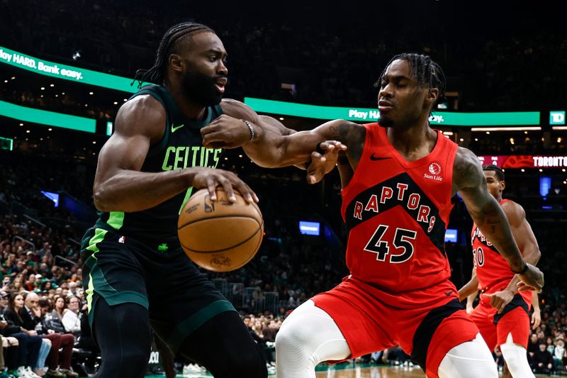 BOSTON, MA - NOVEMBER 16: Jaylen Brown #7 of the Boston Celtics tries to get past Davion Mitchell #45 of the Toronto Raptors during the first quarter at TD Garden on November 16, 2024 in Boston, Massachusetts. NOTE TO USER: User expressly acknowledges and agrees that, by downloading and/or using this Photograph, user is consenting to the terms and conditions of the Getty Images License Agreement. (Photo By Winslow Townson/Getty Images)