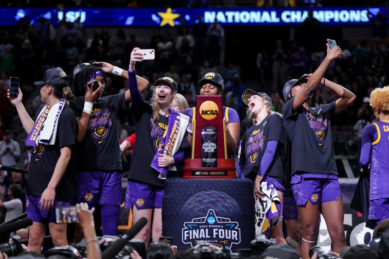 Apr 2, 2023; Dallas, TX, USA; The LSU Lady Tigers celebrate with the tournament trophy after defeating the Iowa Hawkeyes during the final round of the Women's Final Four NCAA tournament at the American Airlines Center. Mandatory Credit: Kirby Lee-USA TODAY Sports