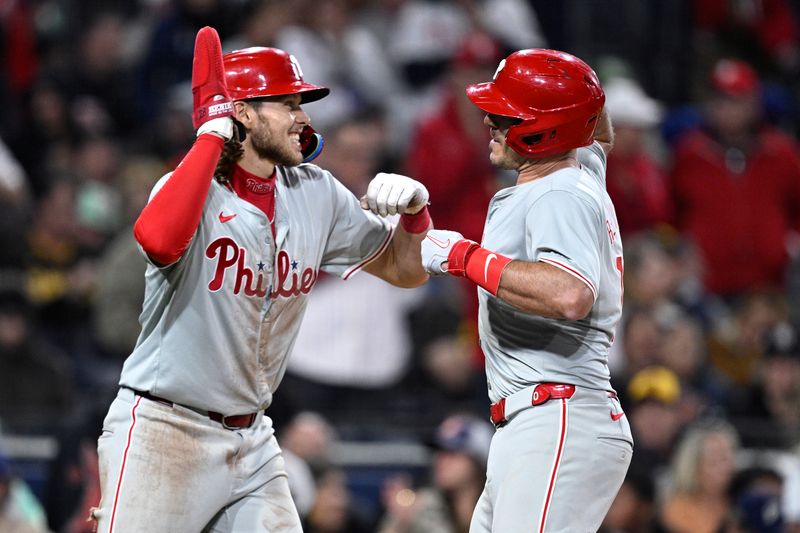 Apr 26, 2024; San Diego, California, USA; Philadelphia Phillies catcher J.T. Realmuto (10) is congratulated by third baseman Alec Bohm (28) after hitting a two-run home run against the San Diego Padres during the seventh inning at Petco Park. Mandatory Credit: Orlando Ramirez-USA TODAY Sports