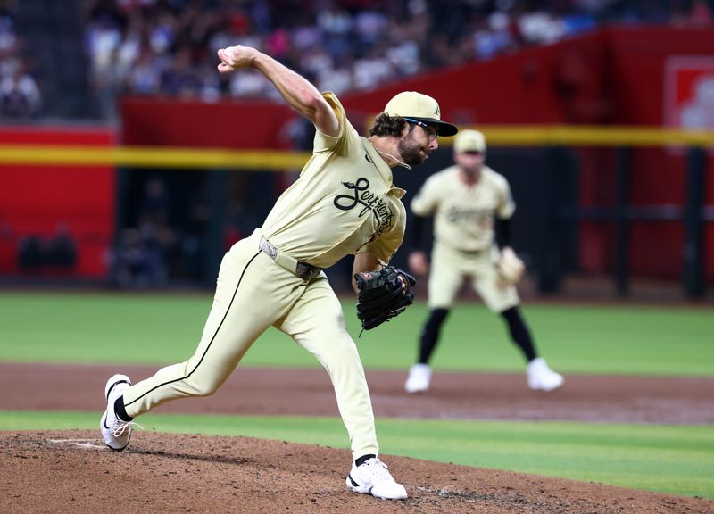 Jul 9, 2024; Phoenix, Arizona, USA; Arizona Diamondbacks pitcher Zac Gallen in the third inning against the Atlanta Braves at Chase Field. Mandatory Credit: Mark J. Rebilas-USA TODAY Sports