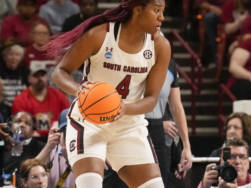 Mar 25, 2023; Greenville, SC, USA; South Carolina Gamecocks forward Aliyah Boston (4) handles the ball against the UCLA Bruins during the first half of the NCAA Women s Tournament at Bon Secours Wellness Arena. Mandatory Credit: Jim Dedmon-USA TODAY Sports