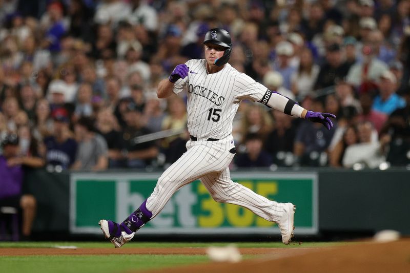 Sep 13, 2024; Denver, Colorado, USA; Colorado Rockies catcher Hunter Goodman (15) slows up after rounding second on an RBI in the fourth inning against the Chicago Cubs at Coors Field. Mandatory Credit: Isaiah J. Downing-Imagn Images