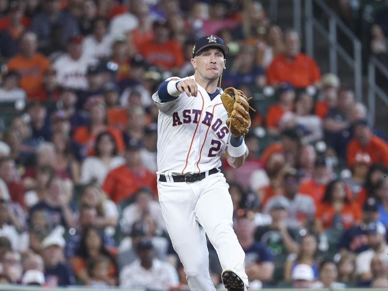 Jul 4, 2023; Houston, Texas, USA; Houston Astros third baseman Alex Bregman (2) throws to first base for an out during the third inning against the Colorado Rockies at Minute Maid Park. Mandatory Credit: Troy Taormina-USA TODAY Sports