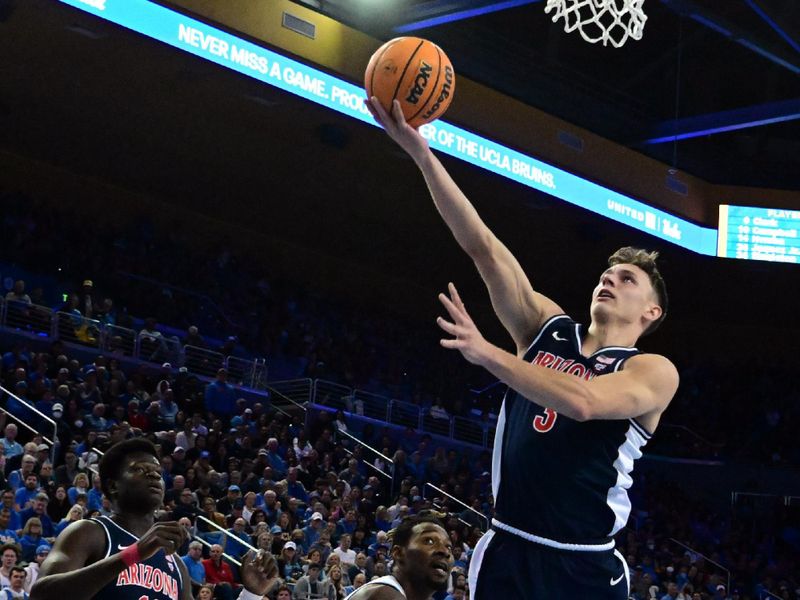 Mar 4, 2023; Los Angeles, California, USA;  Arizona Wildcats guard Pelle Larsson (3) shoots the ball during the first half against UCLA Bruins forward Kenneth Nwuba (14) at Pauley Pavilion presented by Wescom. Mandatory Credit: Richard Mackson-USA TODAY Sports