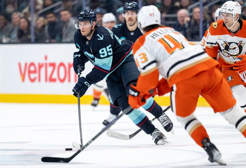 Jan 28, 2025; Seattle, Washington, USA;  Seattle Kraken forward Andre Burakovsky (95) skates against Anaheim Ducks a32n and forward Cutter Gauthier (61) during the second period at Climate Pledge Arena. Mandatory Credit: Stephen Brashear-Imagn Images