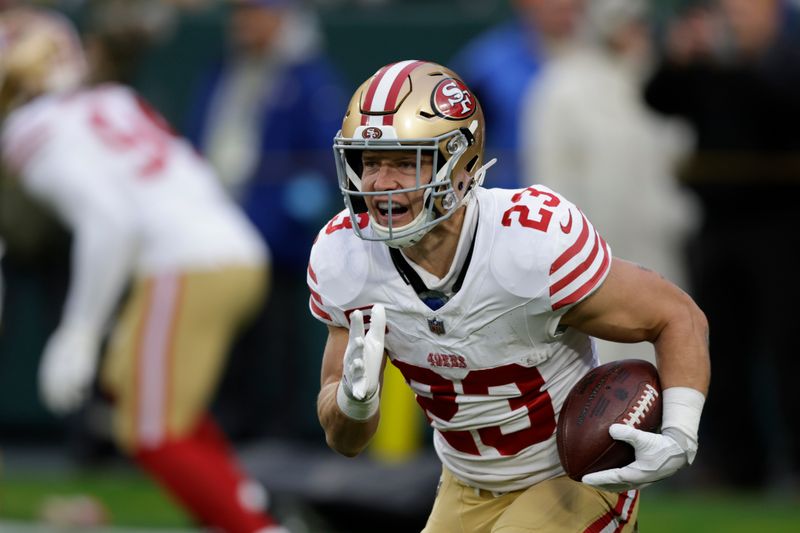 San Francisco 49ers running back Christian McCaffrey (23) warms up before an NFL football game against the Green Bay Packers on Sunday, Nov. 24, 2024 in Green Bay, Wis. (AP Photo/Matt Ludtke)