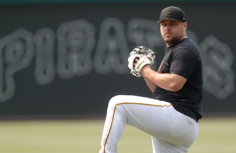 May 24, 2023; Pittsburgh, Pennsylvania, USA; Pittsburgh Pirates relief pitcher David Bednar (51) throws in the outfield before the game against the Texas Rangers at PNC Park. Mandatory Credit: Charles LeClaire-USA TODAY Sports