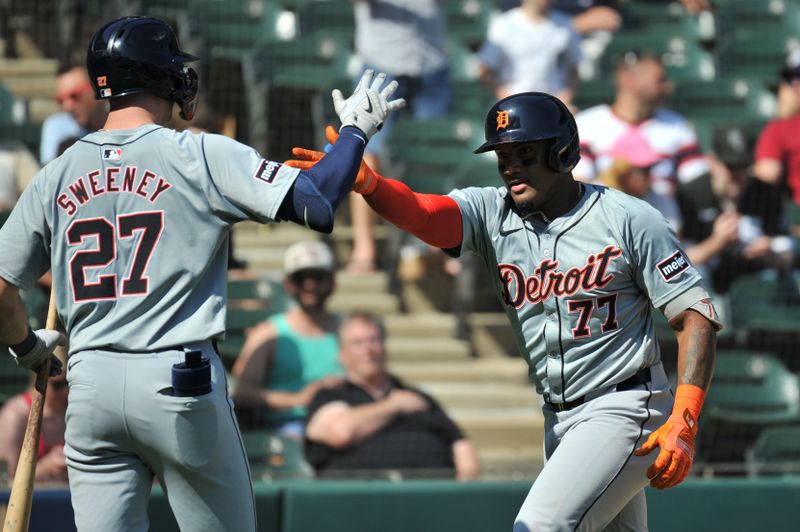 Aug 25, 2024; Chicago, Illinois, USA; Detroit Tigers second base Andy Ibanez (77) celebrates his two-run home run with shortstop Trey Sweeney (27) during the seventh inning against the Chicago White Sox at Guaranteed Rate Field. Mandatory Credit: Patrick Gorski-USA TODAY Sports