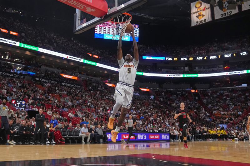 MIAMI, FL - MARCH 13: Kentavious Caldwell-Pope #5 of the Denver Nuggets dunks the ball during the game against the Miami Heat on March 13, 2024 at Kaseya Center in Miami, Florida. NOTE TO USER: User expressly acknowledges and agrees that, by downloading and or using this Photograph, user is consenting to the terms and conditions of the Getty Images License Agreement. Mandatory Copyright Notice: Copyright 2024 NBAE (Photo by Eric Espada/NBAE via Getty Images)