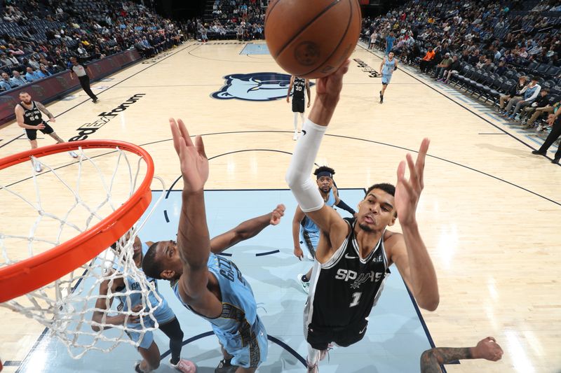 MEMPHIS, TN - APRIL 9: Victor Wembanyama #1 of the San Antonio Spurs drives to the basket during the game against the Memphis Grizzlies on April 9, 2024 at FedExForum in Memphis, Tennessee. NOTE TO USER: User expressly acknowledges and agrees that, by downloading and or using this photograph, User is consenting to the terms and conditions of the Getty Images License Agreement. Mandatory Copyright Notice: Copyright 2024 NBAE (Photo by Joe Murphy/NBAE via Getty Images)