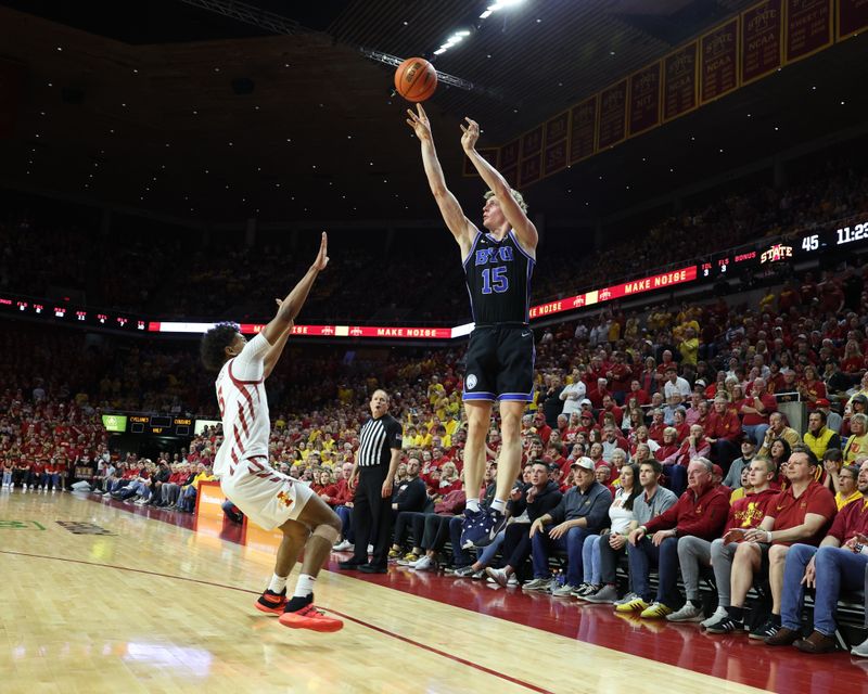 Mar 6, 2024; Ames, Iowa, USA; Brigham Young Cougars guard Richie Saunders (15) shoots over Iowa State Cyclones guard Curtis Jones (5) in the second half at James H. Hilton Coliseum. Mandatory Credit: Reese Strickland-USA TODAY Sports

