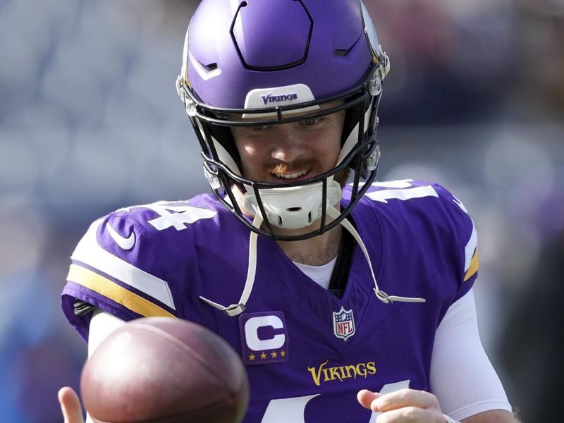 Minnesota Vikings quarterback Sam Darnold warms up before an NFL football game against the Chicago Bears, Sunday, Nov. 24, 2024, in Chicago. (AP Photo/Charles Rex Arbogast)