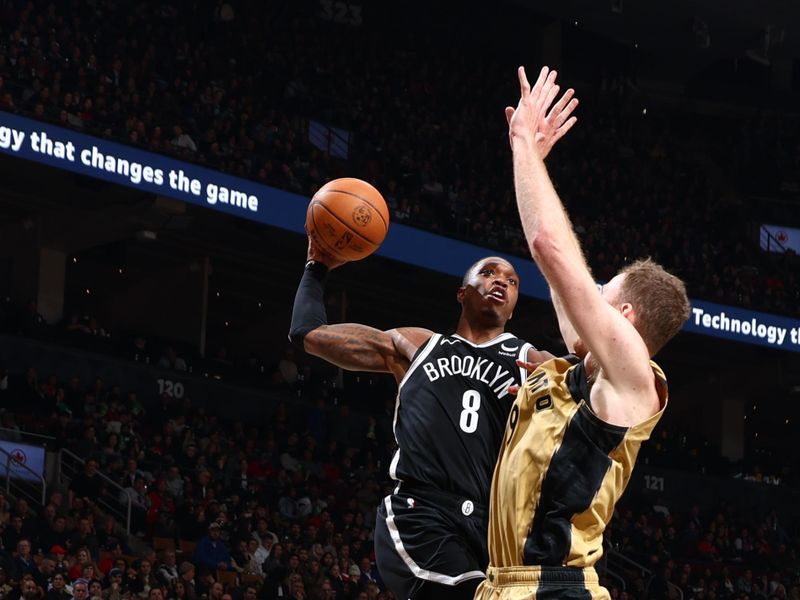 TORONTO, CANADA - FEBRUARY 22: Lonnie Walker IV #8 of the Brooklyn Nets drives to the basket during the game against the Toronto Raptors on February 22, 2024 at the Scotiabank Arena in Toronto, Ontario, Canada.  NOTE TO USER: User expressly acknowledges and agrees that, by downloading and or using this Photograph, user is consenting to the terms and conditions of the Getty Images License Agreement.  Mandatory Copyright Notice: Copyright 2024 NBAE (Photo by Vaughn Ridley/NBAE via Getty Images)