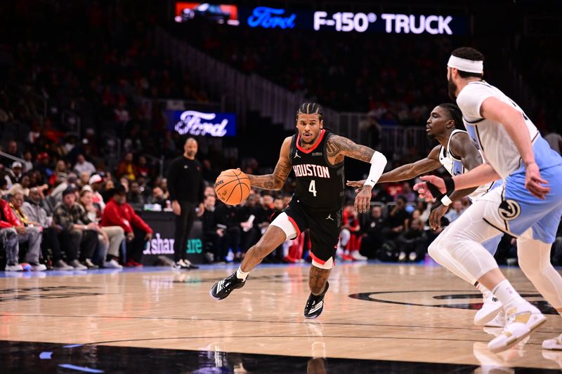 ATLANTA, GA - JANUARY 28: Jalen Green #4 of the Houston Rockets handles the ball during the game against the Atlanta Hawks on January 28, 2025 at State Farm Arena in Atlanta, Georgia.  NOTE TO USER: User expressly acknowledges and agrees that, by downloading and/or using this Photograph, user is consenting to the terms and conditions of the Getty Images License Agreement. Mandatory Copyright Notice: Copyright 2025 NBAE (Photo by Adam Hagy/NBAE via Getty Images)