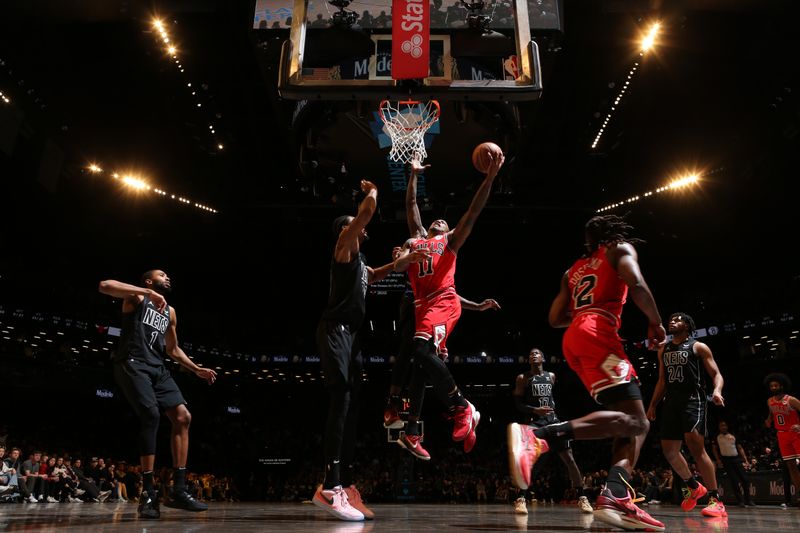 BROOKLYN, NY - MARCH 29: DeMar DeRozan #11 of the Chicago Bulls dribbles the ball during the game against the Brooklyn Nets on March 29, 2024 at Barclays Center in Brooklyn, New York. NOTE TO USER: User expressly acknowledges and agrees that, by downloading and or using this Photograph, user is consenting to the terms and conditions of the Getty Images License Agreement. Mandatory Copyright Notice: Copyright 2024 NBAE (Photo by Nathaniel S. Butler/NBAE via Getty Images)