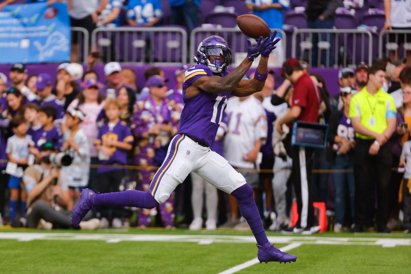 Minnesota Vikings wide receiver Trent Sherfield Sr. (11) catches a pass during warm-ups before an NFL football game against the Detroit Lions Sunday, Oct. 20, 2024, in Minneapolis. (AP Photo/Bruce Kluckhohn)