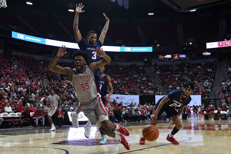 Feb 3, 2023; Las Vegas, Nevada, USA; UNLV Runnin' Rebels guard EJ Harkless (55) reacts to a foul from Fresno State Bulldogs guard Donavan Yap (0) in the first half at Thomas & Mack Center. Mandatory Credit: Candice Ward-USA TODAY Sports