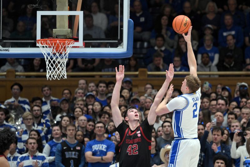 Feb 15, 2025; Durham, North Carolina, USA;  Duke Blue Devils forward Cooper Flagg (2) shoots a hook shot against Stanford Cardinal forward Maxime Raynaud (42) during the first half at Cameron Indoor Stadium. Mandatory Credit: Zachary Taft-Imagn Images