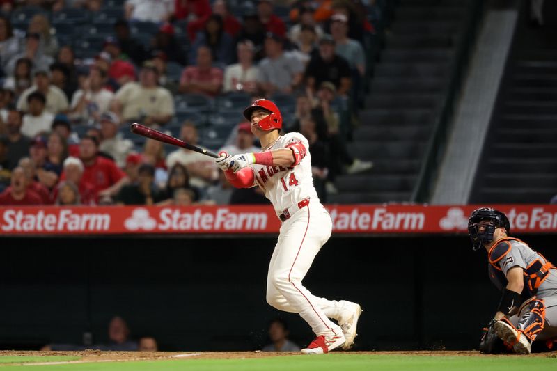 Jun 28, 2024; Anaheim, California, USA;  Los Angeles Angels catcher Logan O'Hoppe (14) hits a three-run home run during the eighth inning against the Detroit Tigers at Angel Stadium. Mandatory Credit: Kiyoshi Mio-USA TODAY Sports