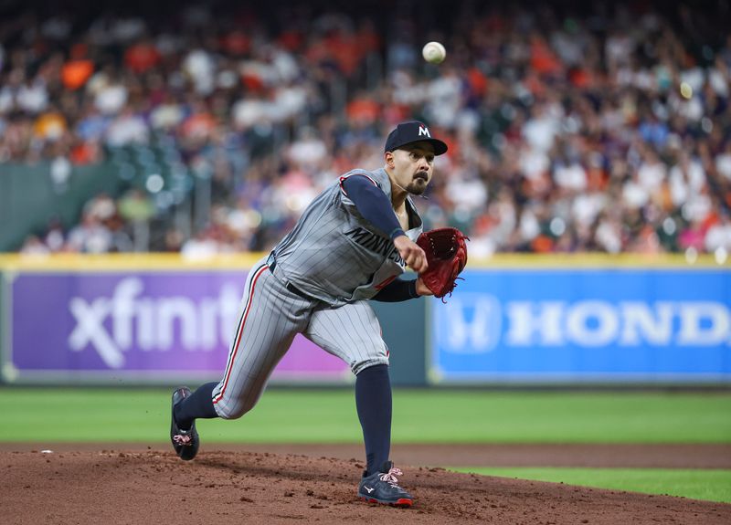 May 31, 2024; Houston, Texas, USA; Minnesota Twins starting pitcher Pablo Lopez (49) delivers a pitch during the second inning against the Houston Astros at Minute Maid Park. Mandatory Credit: Troy Taormina-USA TODAY Sports