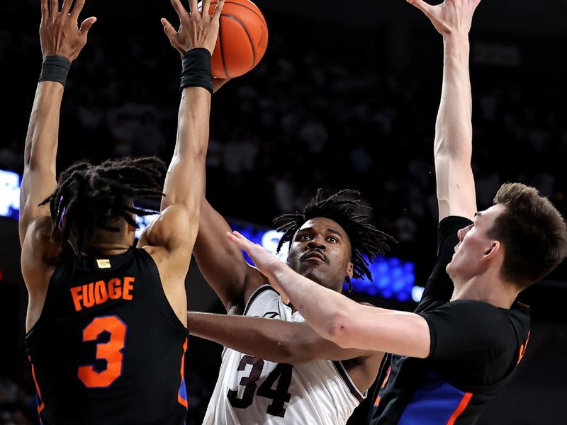 Jan 18, 2023; College Station, Texas, USA; Texas A&M Aggies forward Julius Marble (34) shoots against the Florida Gators defends during the second half at Reed Arena. Mandatory Credit: Erik Williams-USA TODAY Sports
