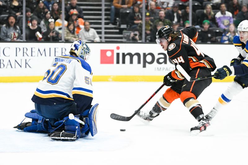 Mar 25, 2023; Anaheim, California, USA; St. Louis Blues goalie Jordan Binnington (50) blocks the goal while Anaheim Ducks left wing Max Comtois (44) closes in during first period at Honda Center. Mandatory Credit: Kelvin Kuo-USA TODAY Sports